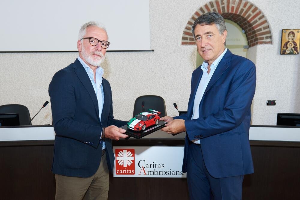 Pietro Innocenti, Amministratore Delegato Porsche Italia e Luciano Gualzetti, Direttore Caritas Milano