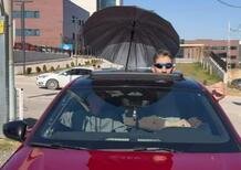 The tallest man in the world drives a Peugeot 308 with an umbrella