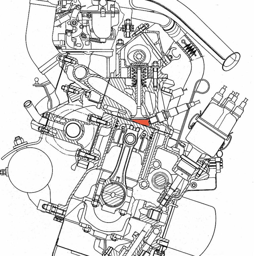 Questa sezione mostra la camera a cuneo impiegata nel motore Fiat 128, entrato in produzione nel 1969. Le valvole sono inclinate rispetto all&rsquo;asse del cilindro. La distribuzione &egrave; a singolo albero a camme in testa, mosso da una cinghia dentata